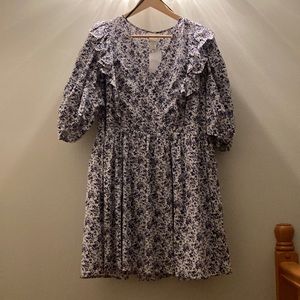 Oversized floral mini dress with puff sleeve, and “wrap” front